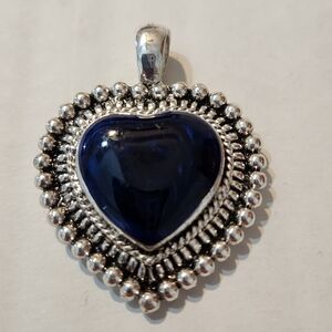 Blue and silver colored heart charm